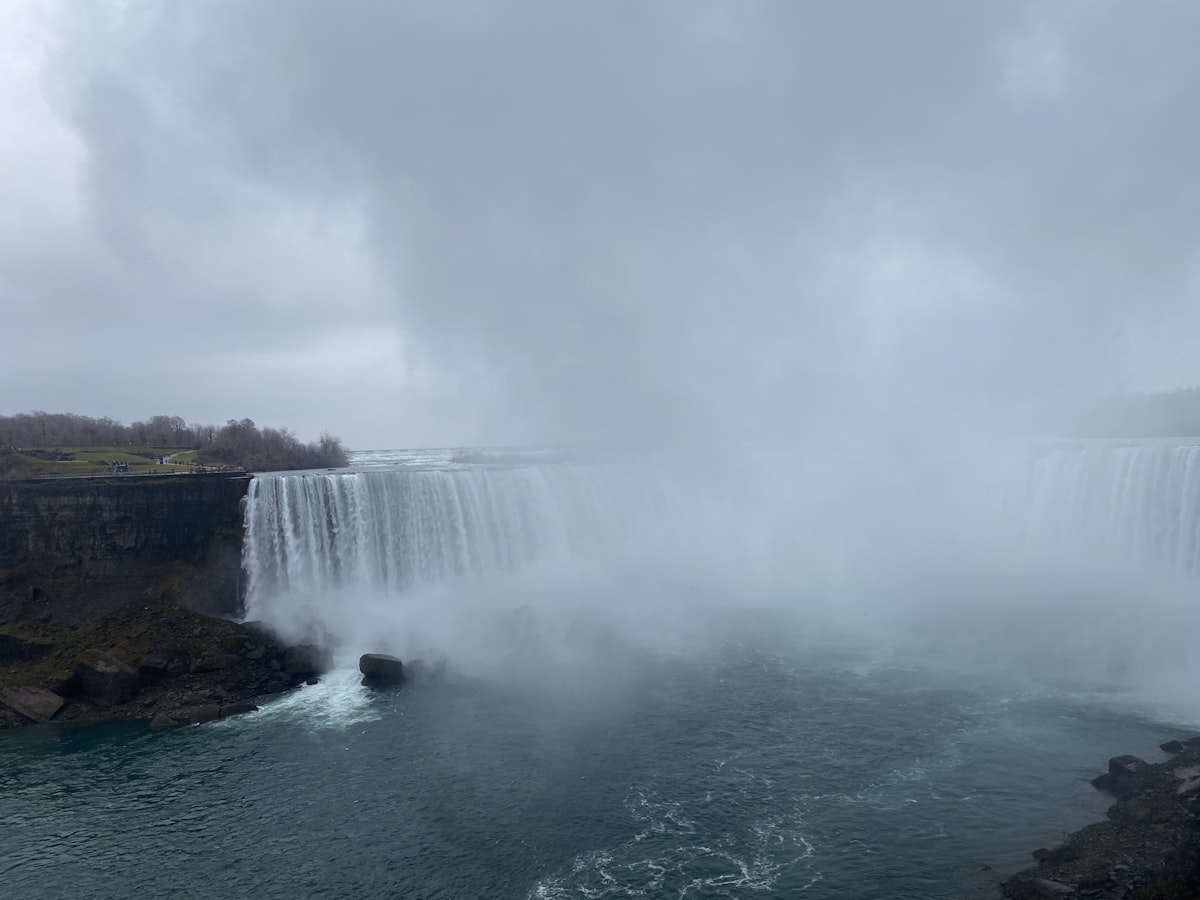 a large waterfall with water pouring out of it