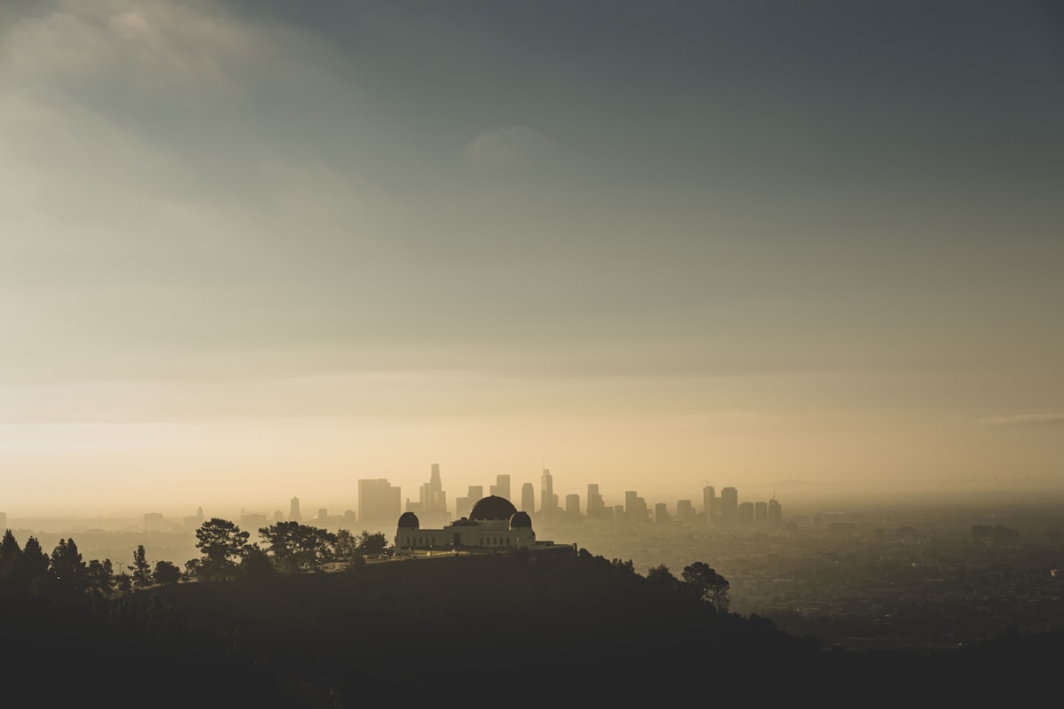 a view of a city from the top of a hill