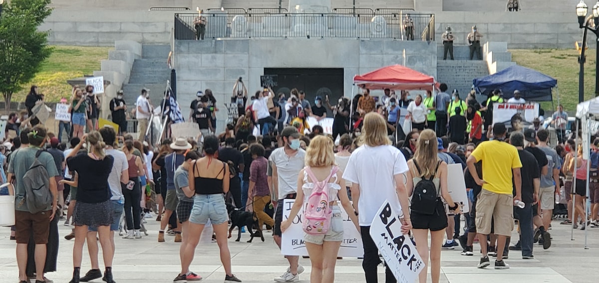 group of people walking on street during daytime
