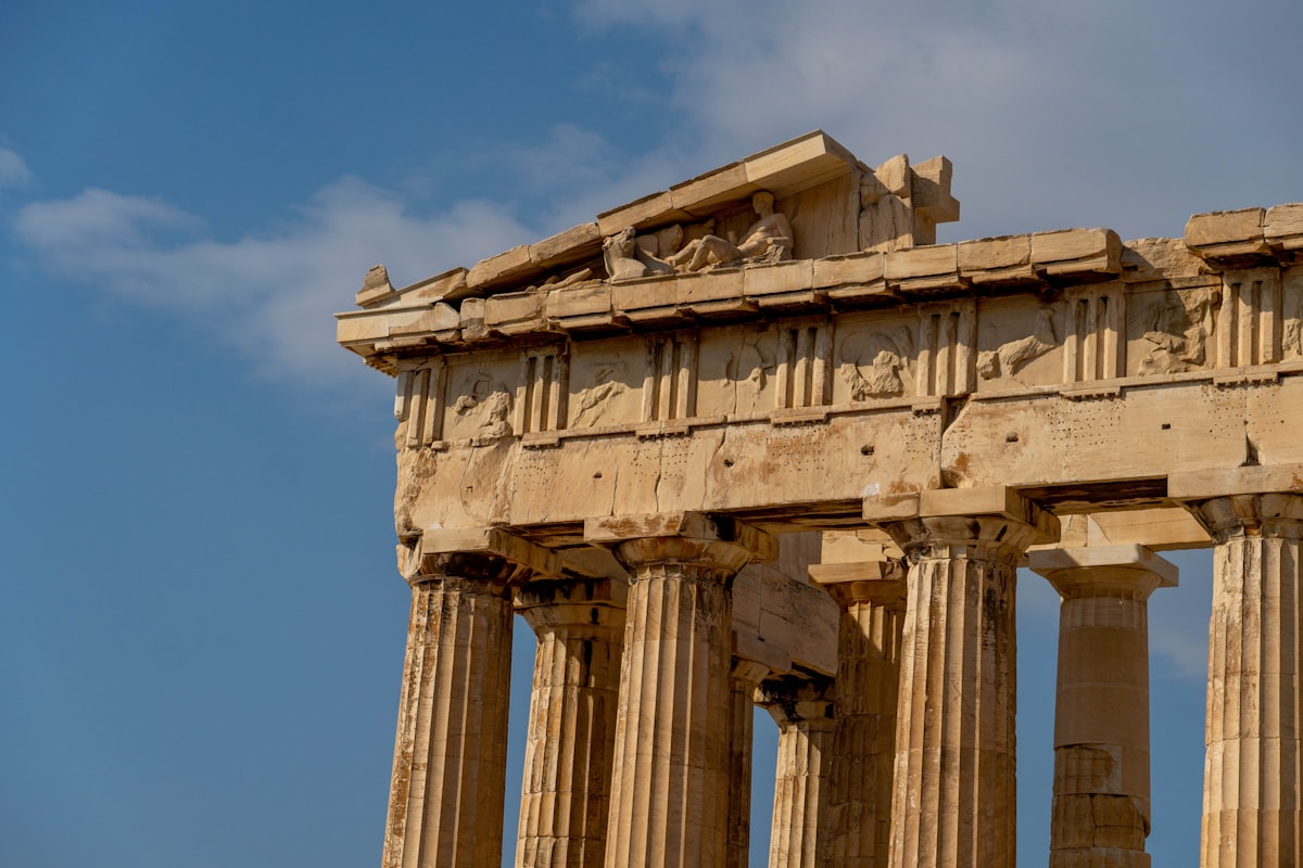a very tall building with some columns on top of it