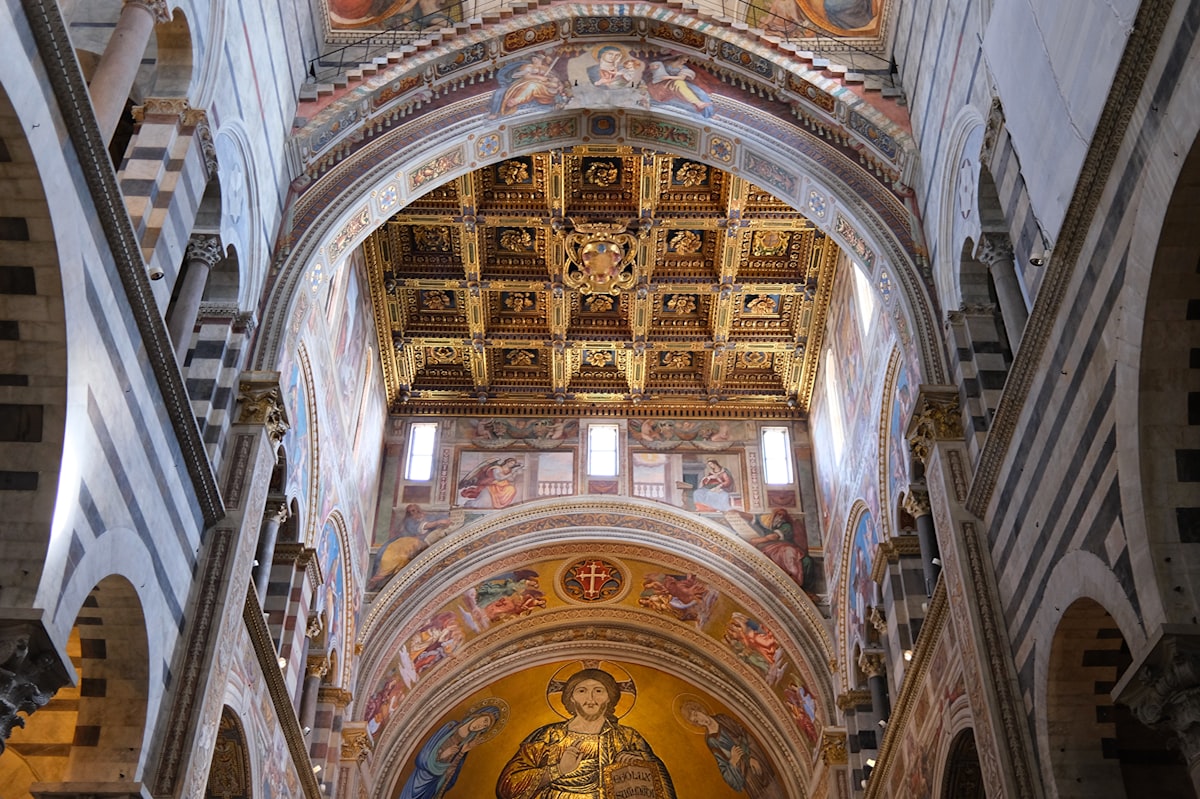 Intricate ceiling and artwork inside a grand cathedral