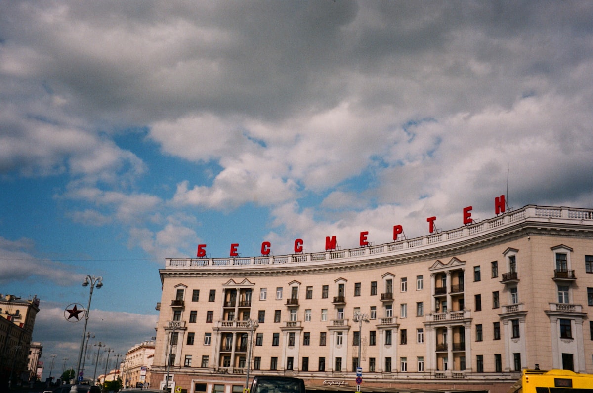 white concrete building under cloudy sky during daytime