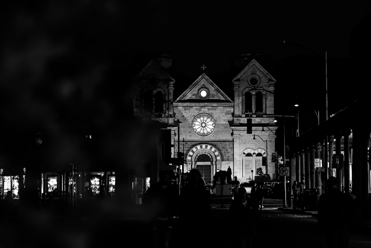 A black and white photo of a clock tower