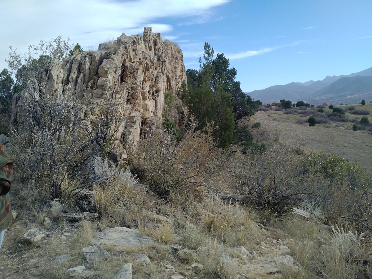 a rocky outcropping in the middle of a field
