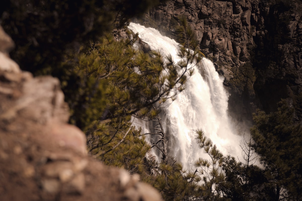 a view of a waterfall from the side of a mountain
