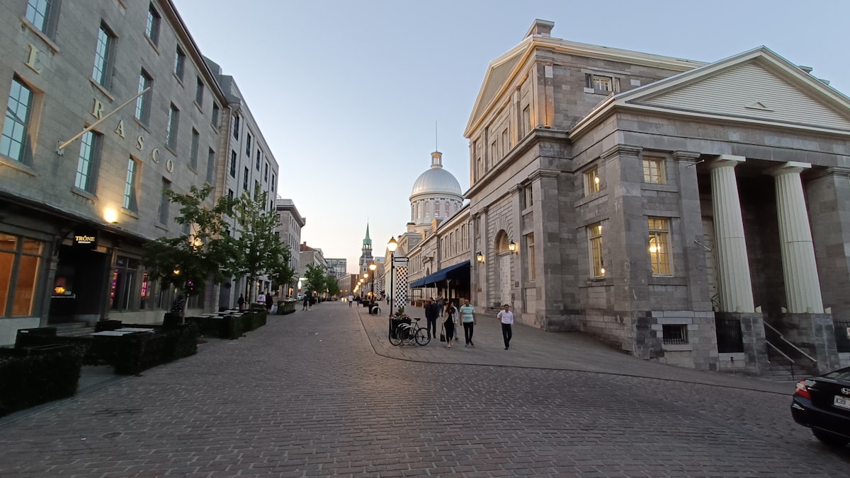 a cobblestone street lined with tall buildings
