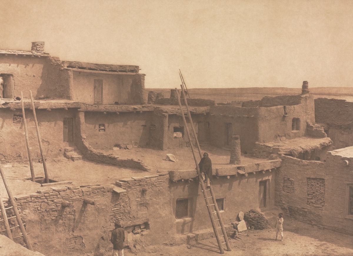 an old photo of a village in the desert