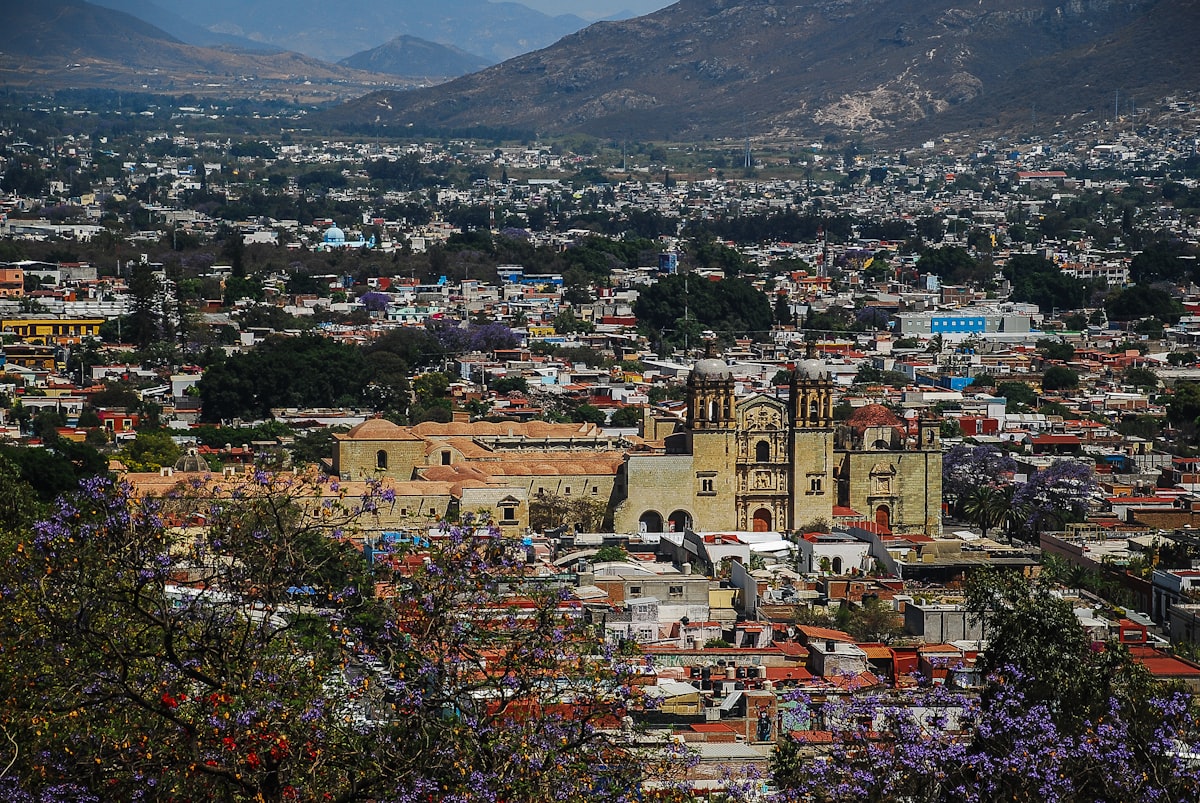 View of a city with mountains in the background.