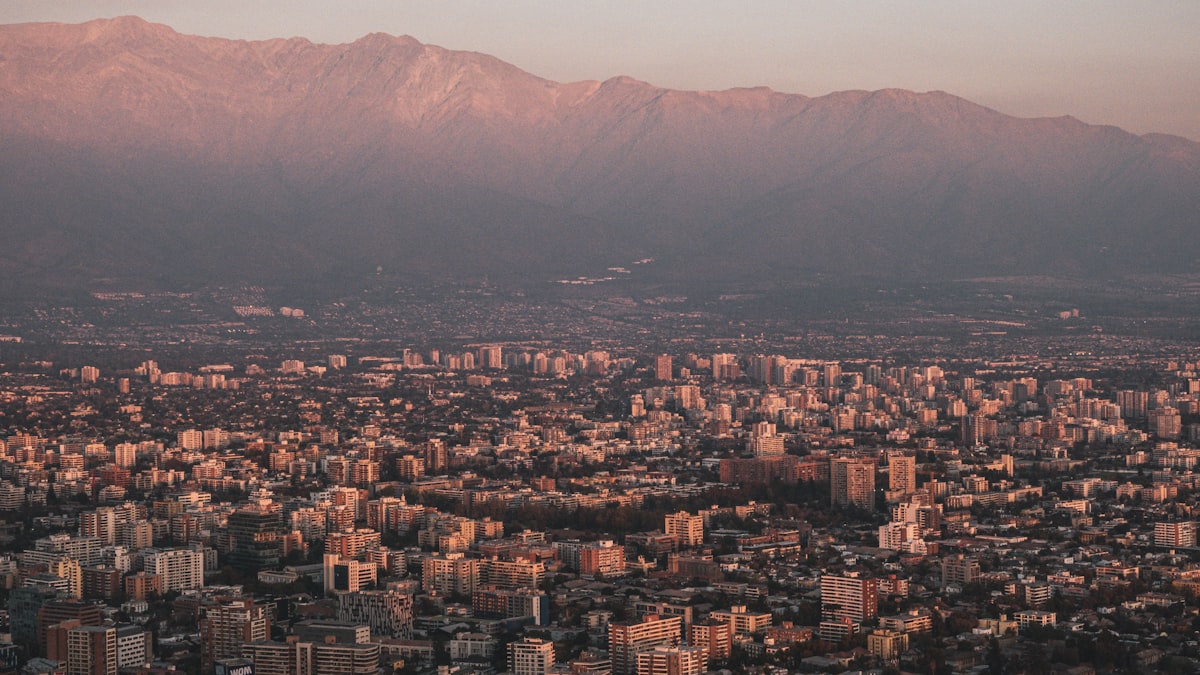 a view of a city with mountains in the background
