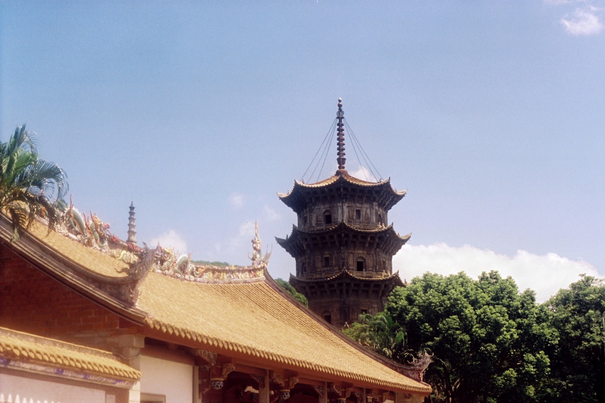 A tower and temple in a beautiful landscape.