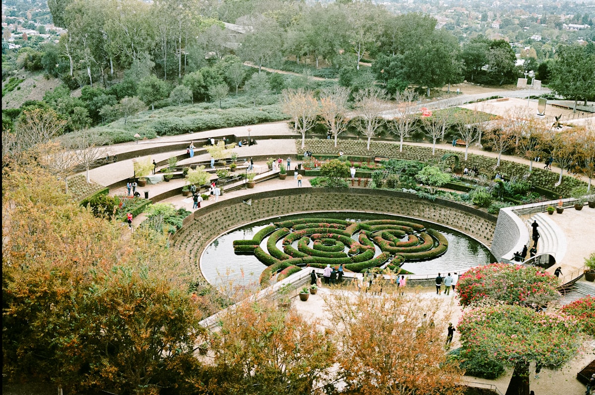 An aerial view of a circular garden in a park