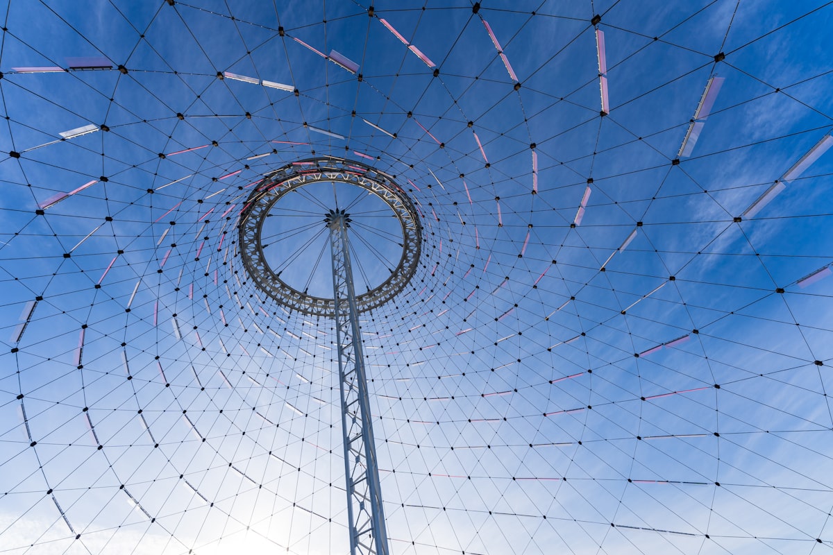 a very tall metal structure with a blue sky in the background