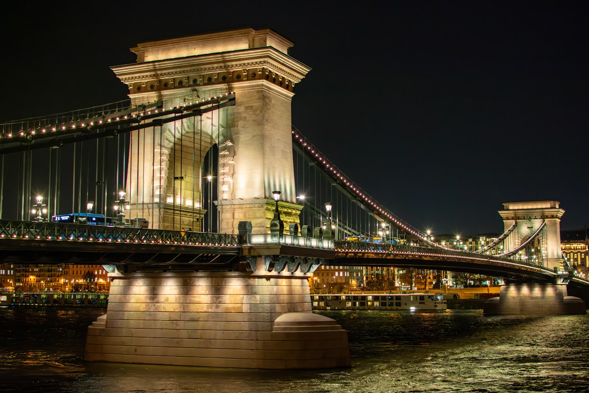a bridge over a body of water at night