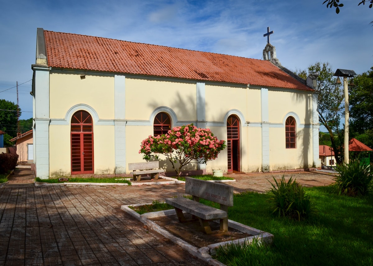 a church with a bench in front of it